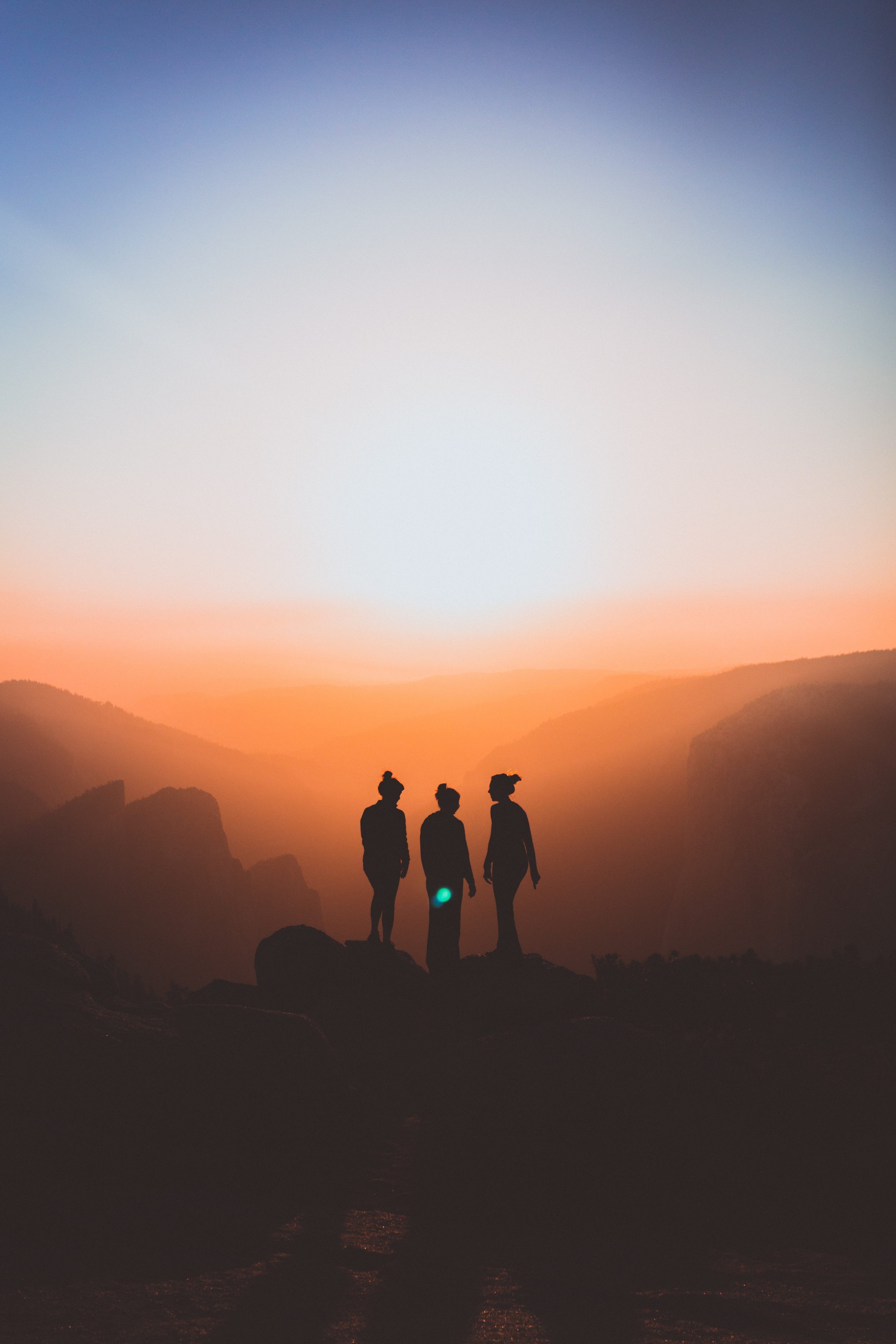 Three women feeling younger by watching the sunrise